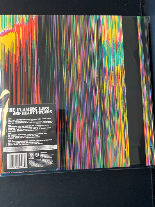 THE FLAMING LIPS “AND HEADY FWENDS”